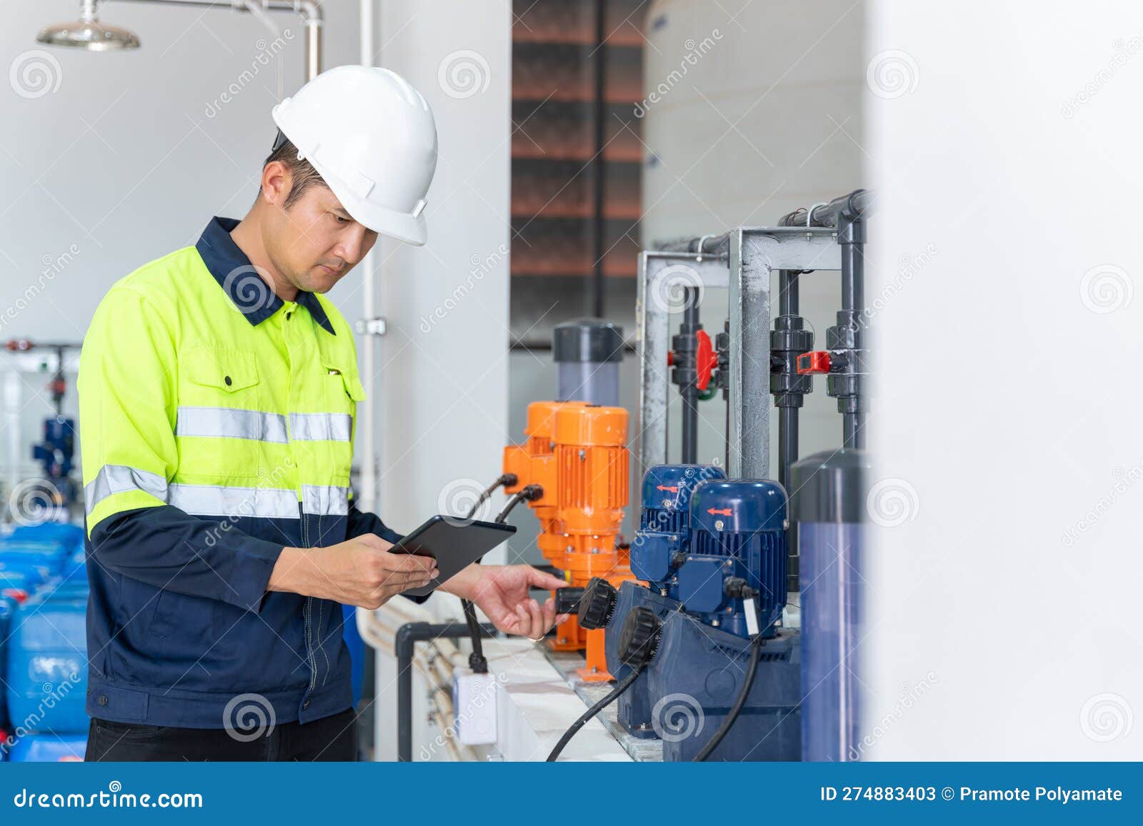 Asian Engineer or Technician Checking Operation of Industrial Water