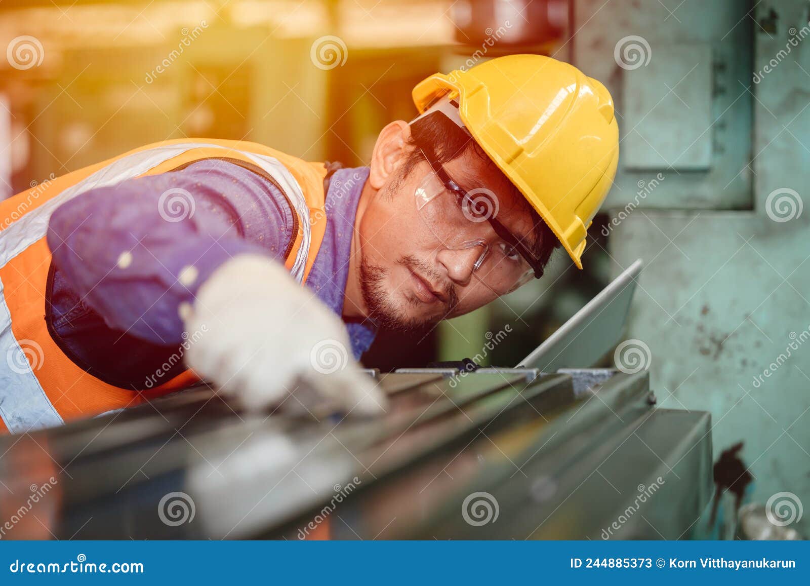 asian engineer worker intends to work professionally in the steel industry, high precision detail job
