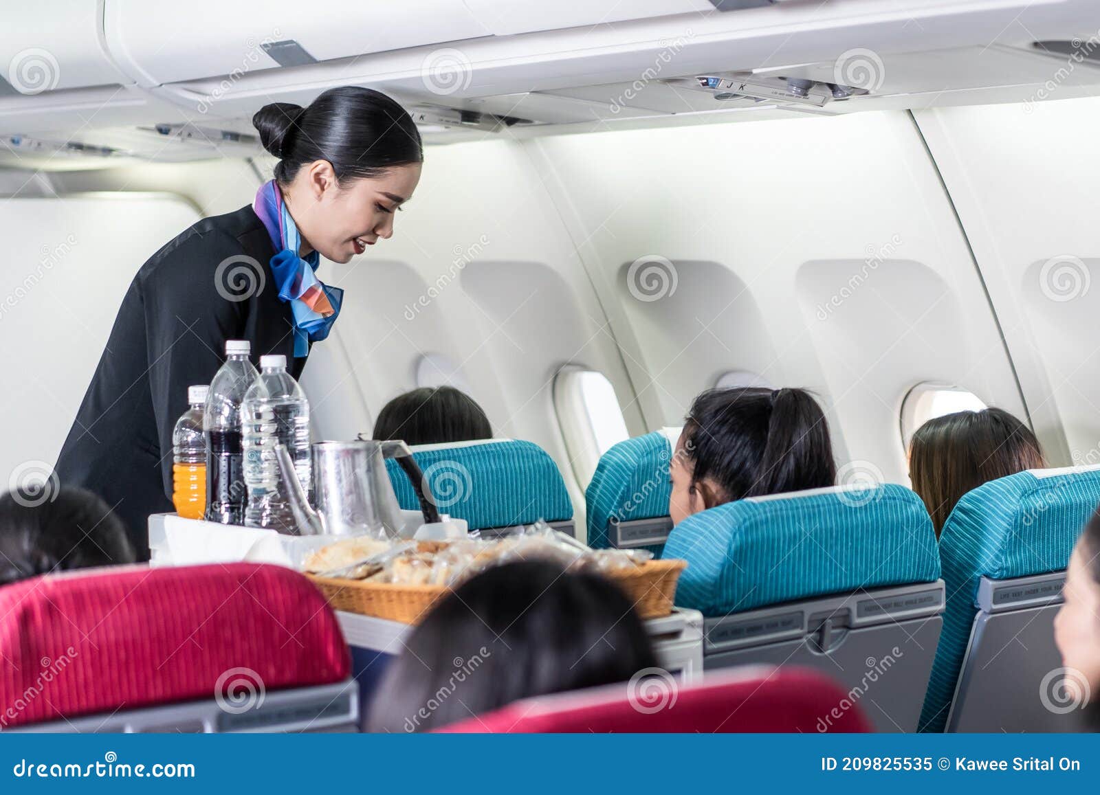 Plastic cup on the table in the plane during the flight. alcohol