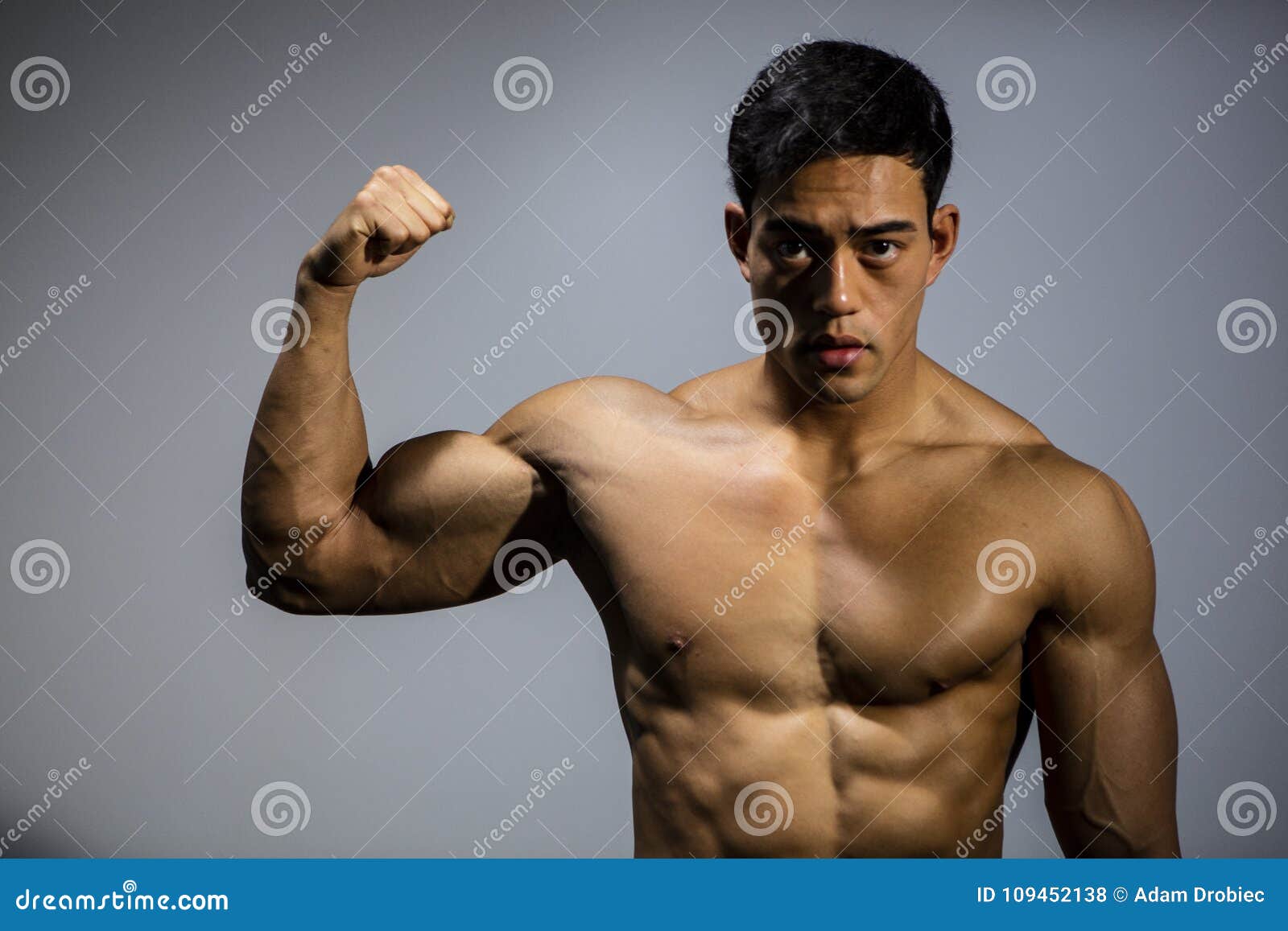 Flexes Bicep Stock Photos - Free & Royalty-Free Stock Photos from Dreamstime