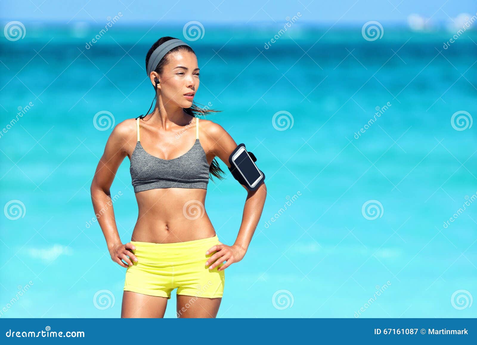 Healthy beautiful young Asian runner woman in sports clothing