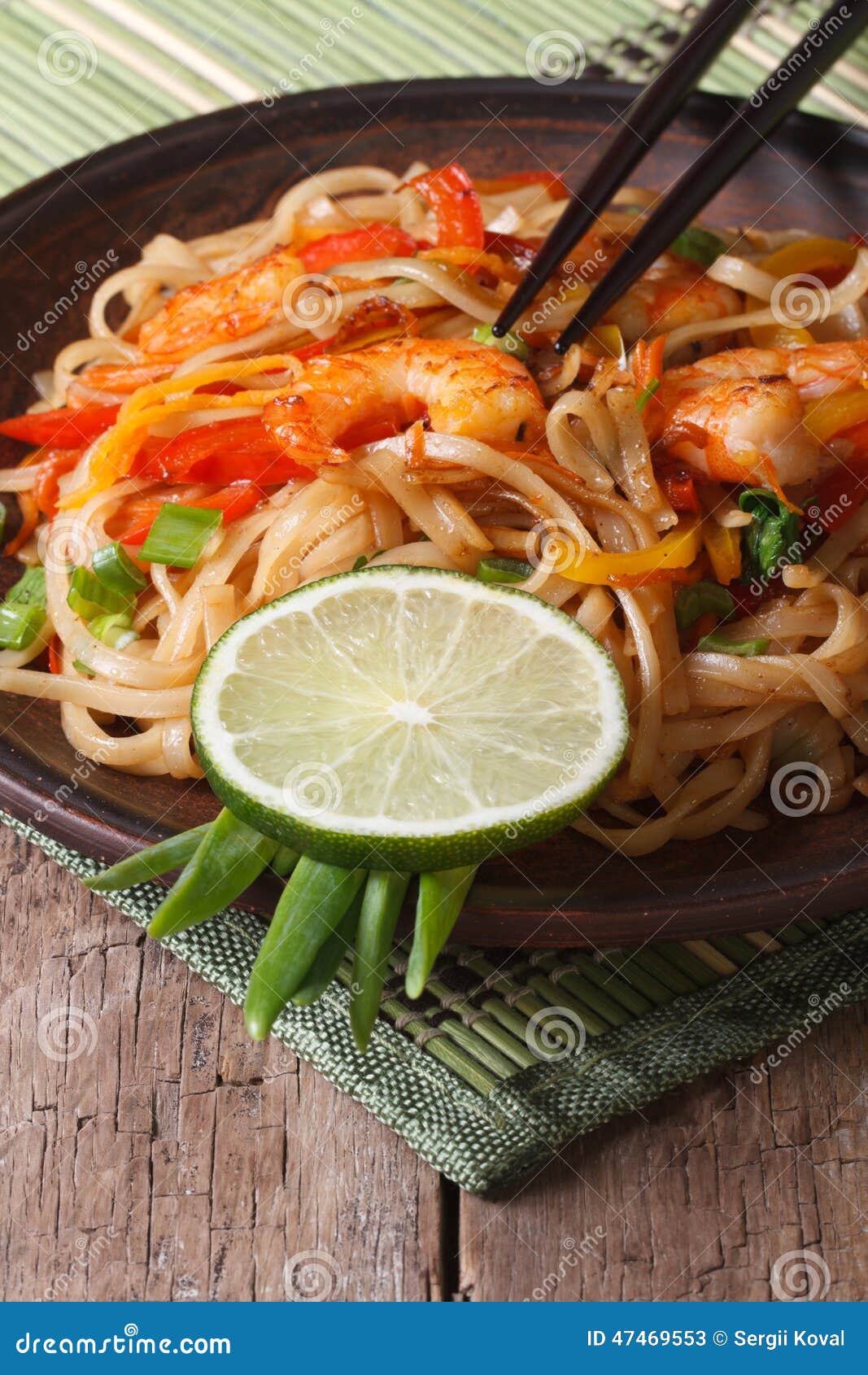 Asian Food: Rice Noodles with Shrimp and Vegetables Vertical Stock