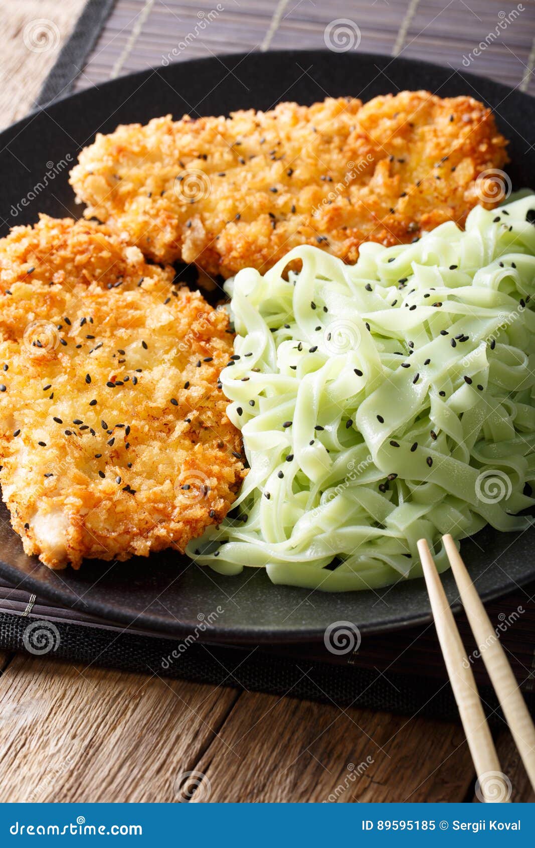 Asian food: steak in breaded Panko and green noodles with sesame.