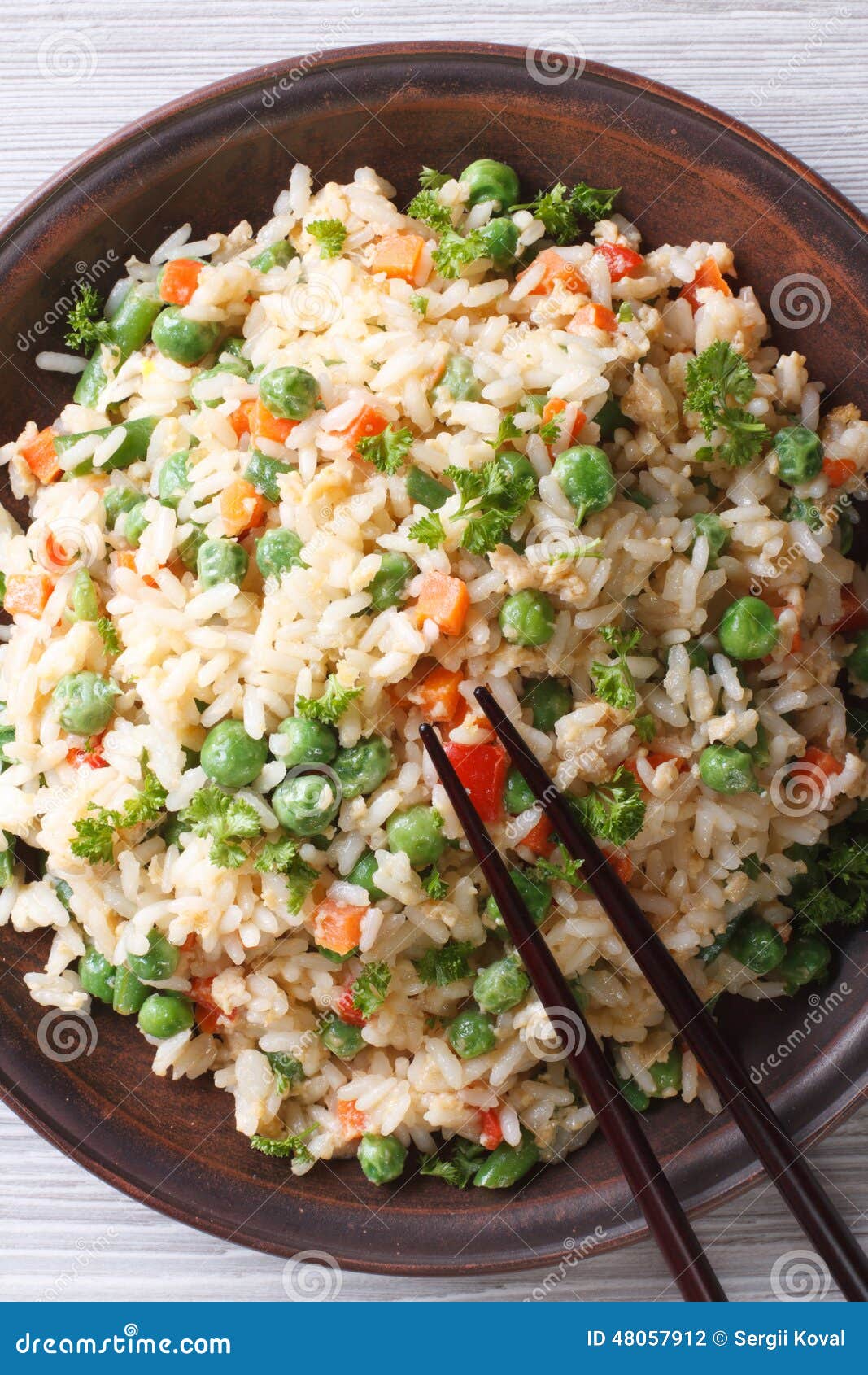 Asian Fried Rice with Egg and Vegetables Top View Vertical Stock Photo