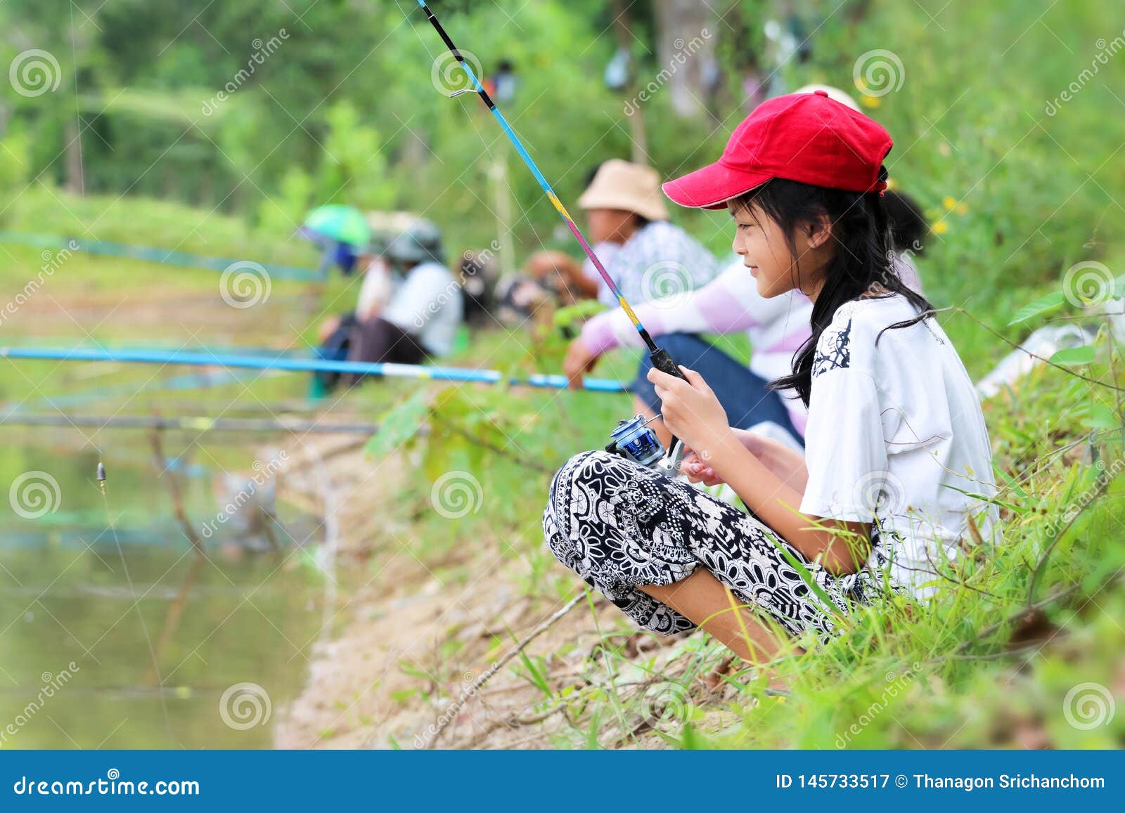 Asian Girl Enjoying To Use a Fishing Rod by the Canal or River Stock Image  - Image of fish, green: 145733517