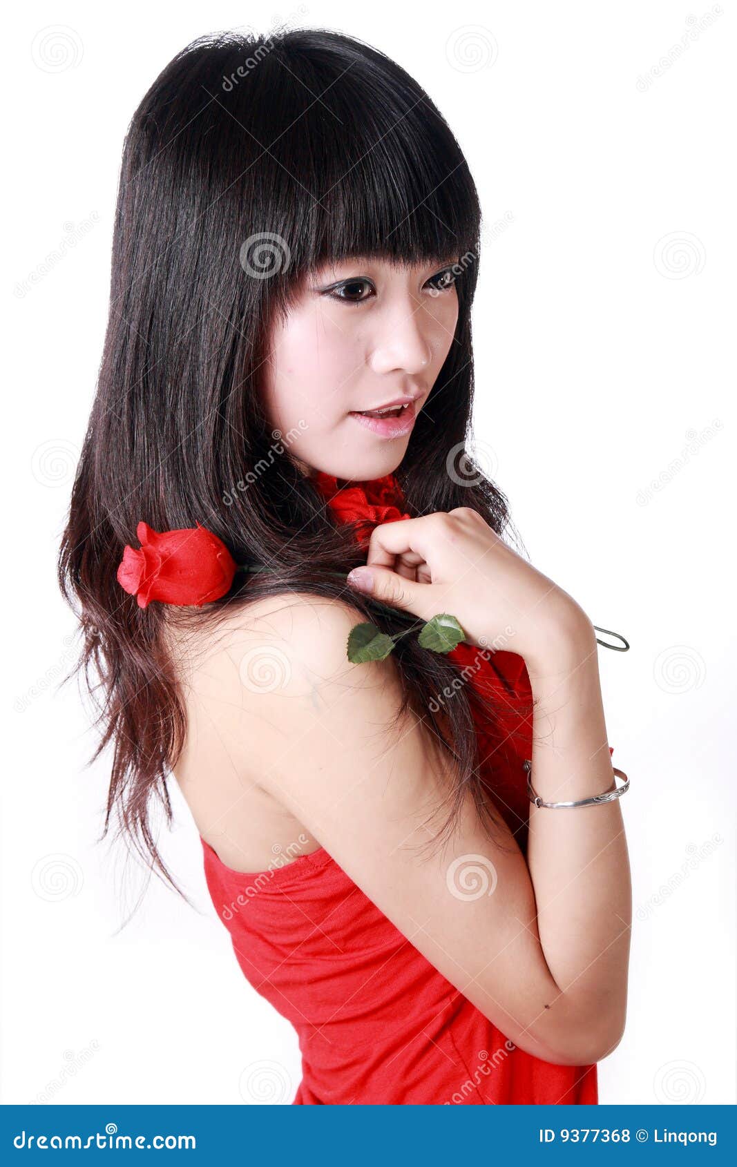 A Girl Holds An Asthma Inhaler Against A Background Of Blooming Royalty