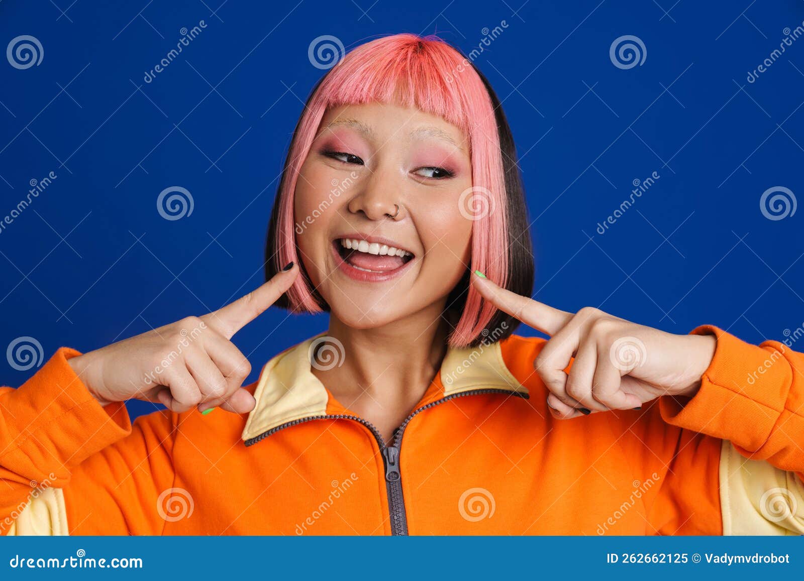 Asian Girl With Pink Hair And Piercing Pointing Fingers At Her Smile Stock Image Image Of