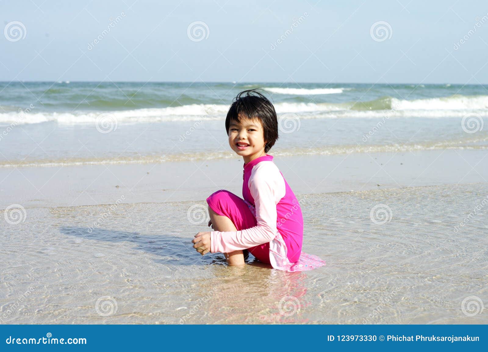 Asian Girl Plays on the Beach and Enjoys Swimming in the Sea in Stock ...