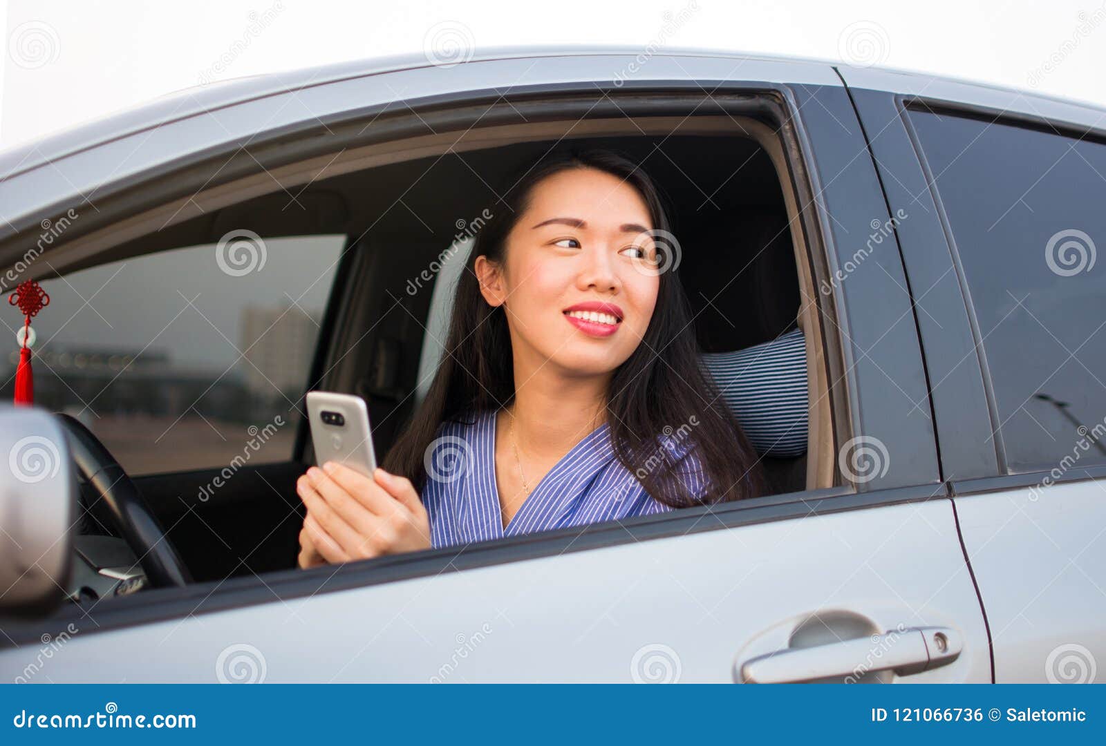 Asian Girl Using Phone in Car Stock Photo - Image of outdoors ...