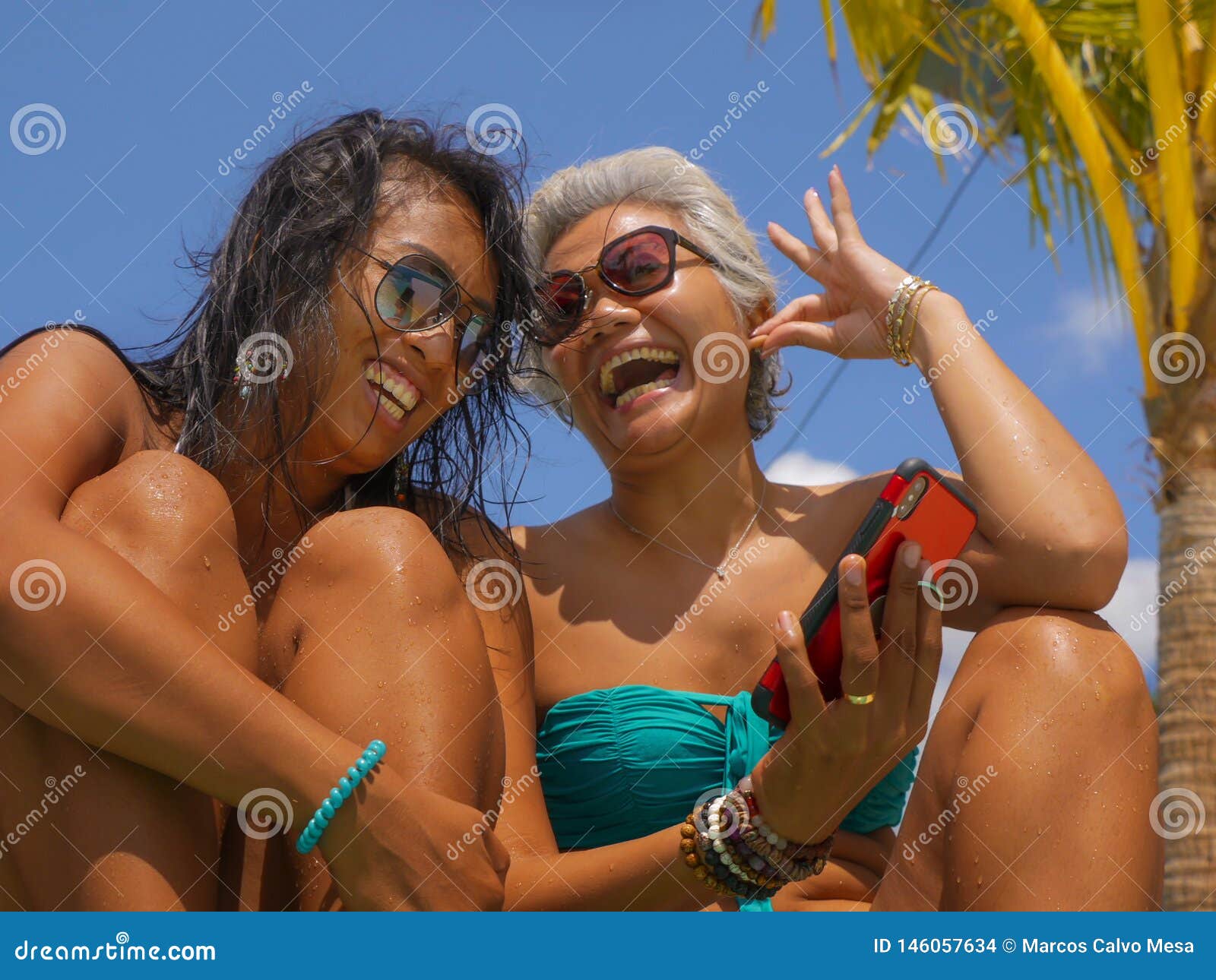 https://thumbs.dreamstime.com/z/asian-girlfriends-bikini-enjoying-summer-holidays-tropical-beach-resort-swimming-pool-having-fun-using-mobile-phone-together-146057634.jpg