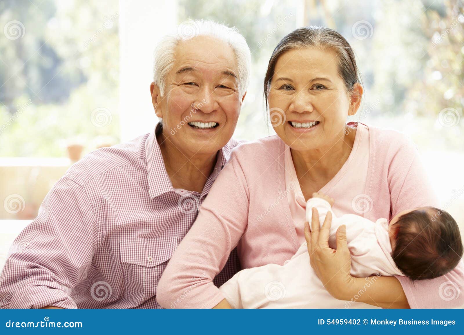 Asian Grandparents Selfie With Granddaughter At Home. Senior Chinese