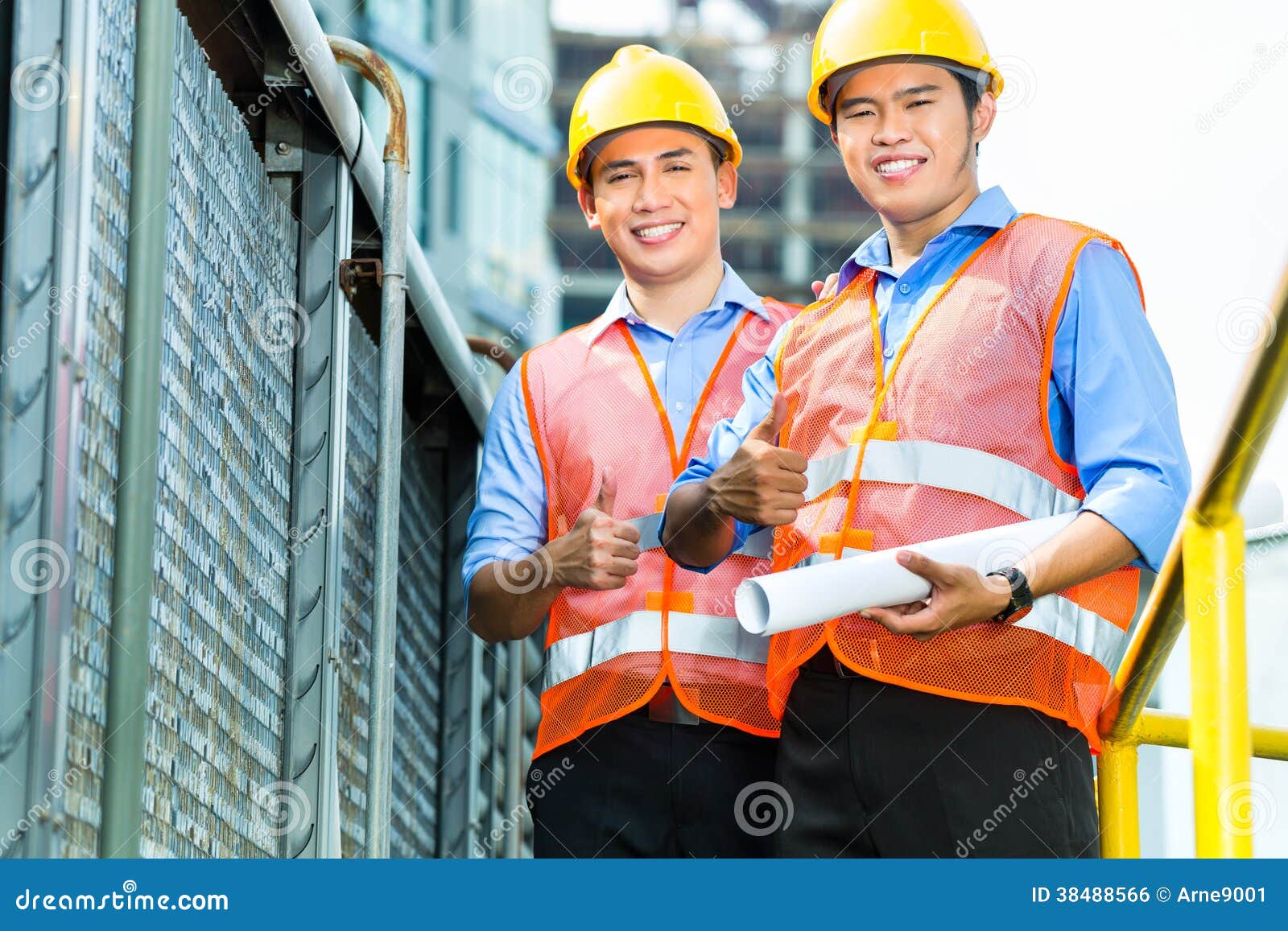 Asian Indonesian Construction Workers on Building Site Stock Photo