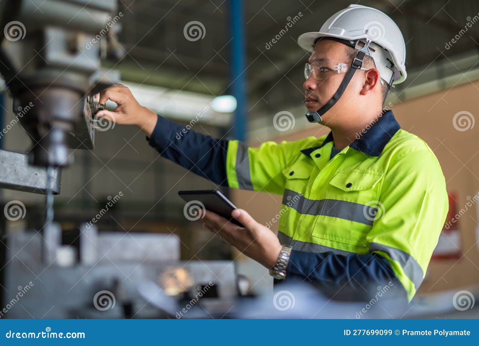 Asian Industrial Workers are Working in the Factory. Machine Engineers or Mechanical Technicians