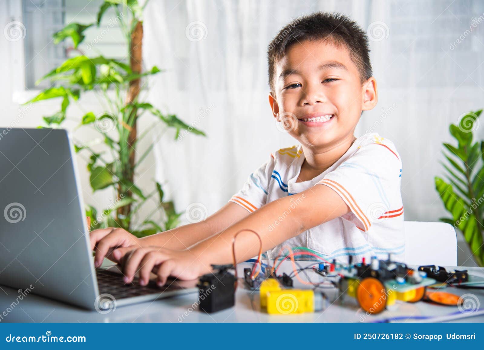 Asian Kid Boy Learns Coding and Programming with Laptop for Arduino ...