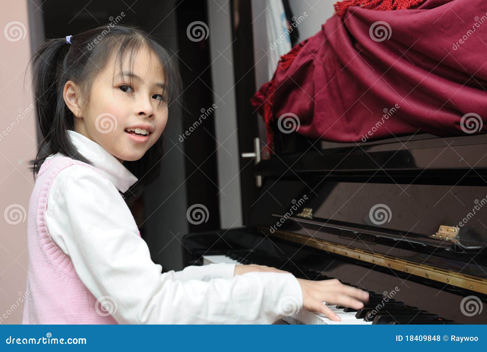 Asian kid playing piano stock photo. Image of learning - 18409848