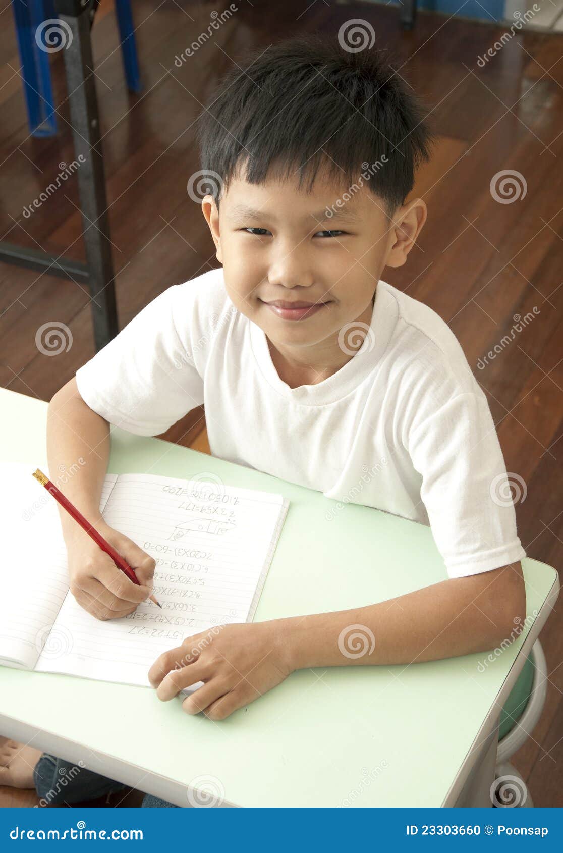 Asian Boy Against Fence With Sad Expression Stock Photo 