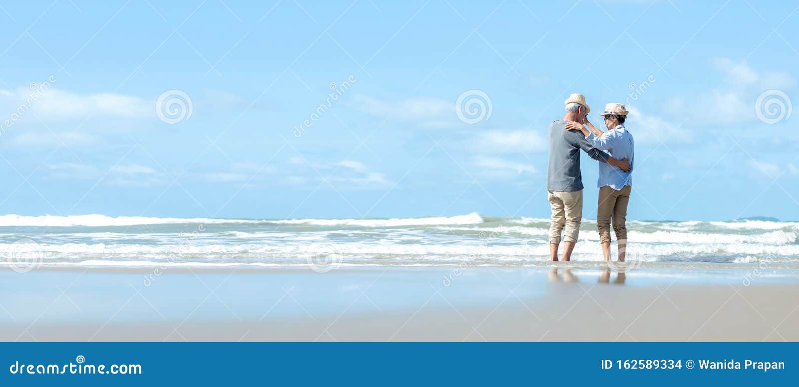 asian lifestyle senior couple dancing on the beach happy and relax time.  tourism elderly family travel leisure and activity after