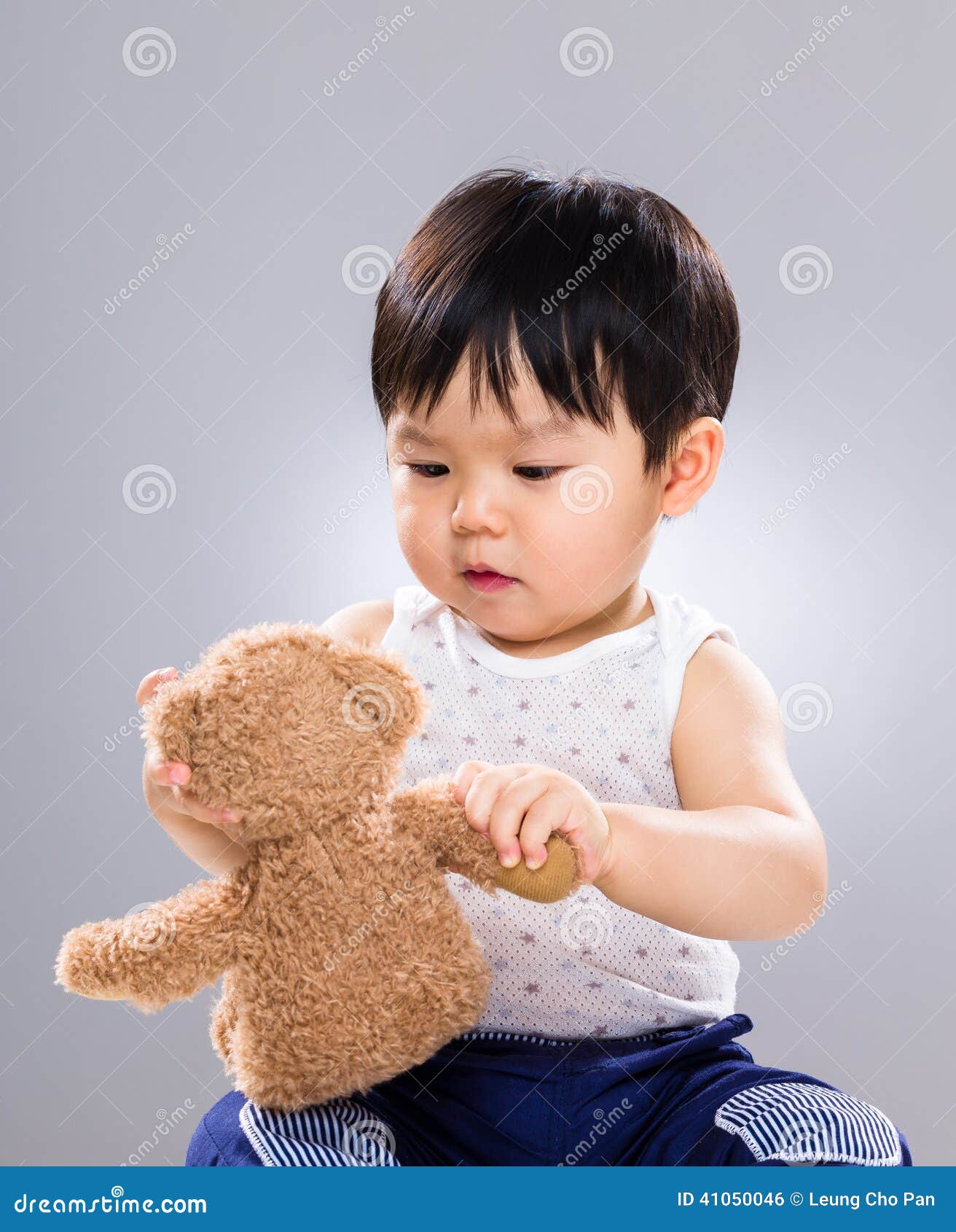 Asian Little Boy Holding Toy Doll Stock Photo - Image of ...