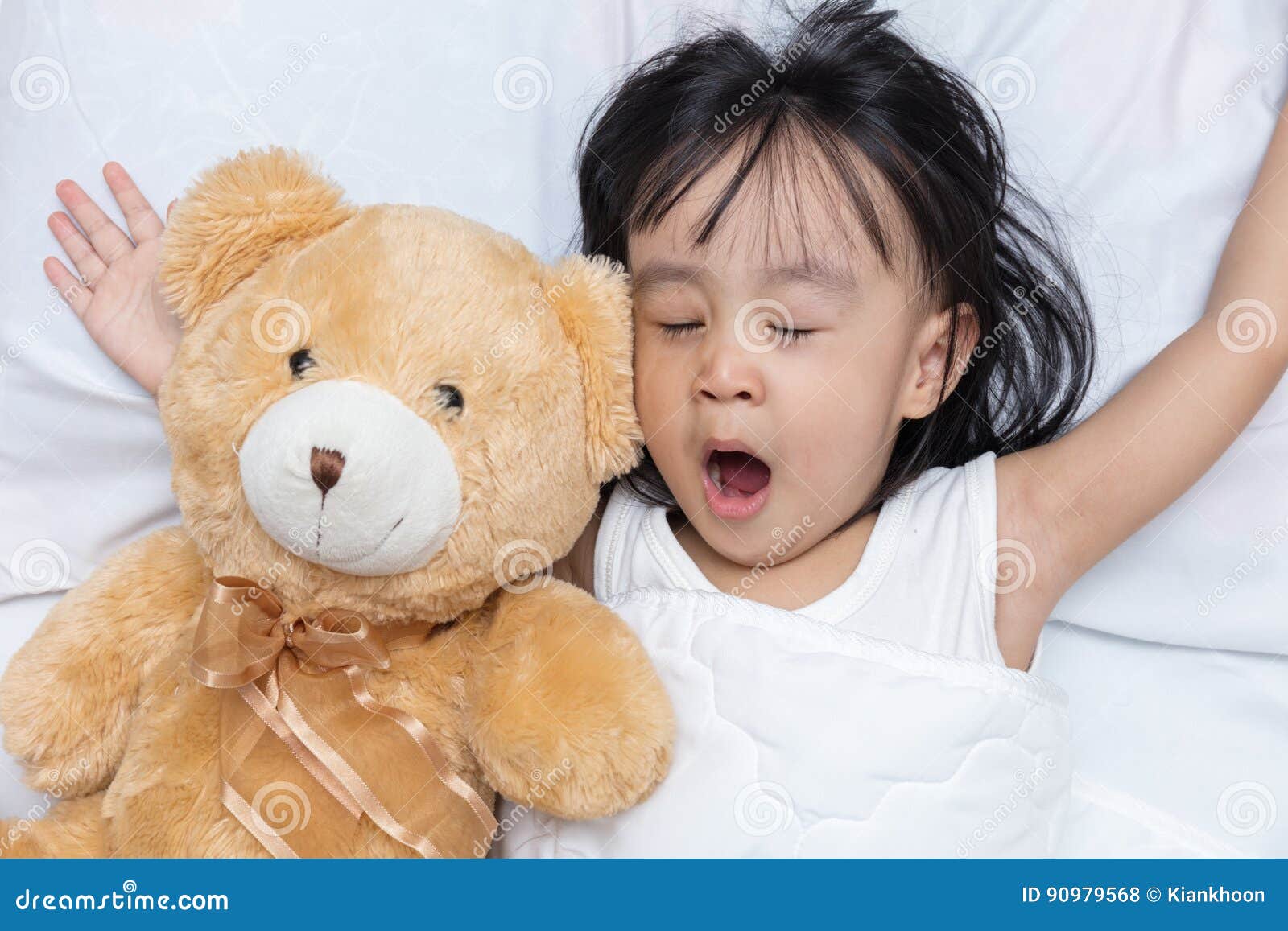 girl sleeping with teddy bear