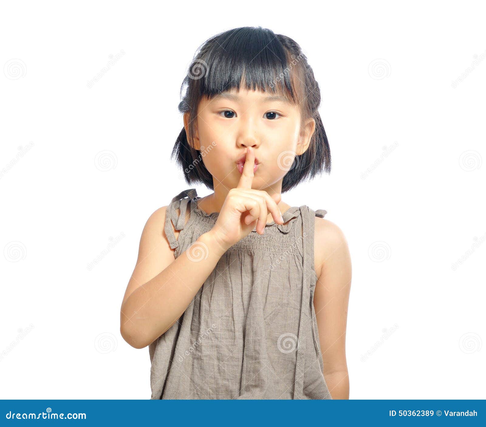 asian little girl finger up to lips for making a quiet gesture i