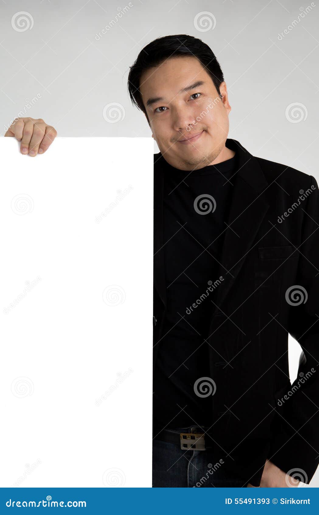 asian man in black suit holds an empty plate