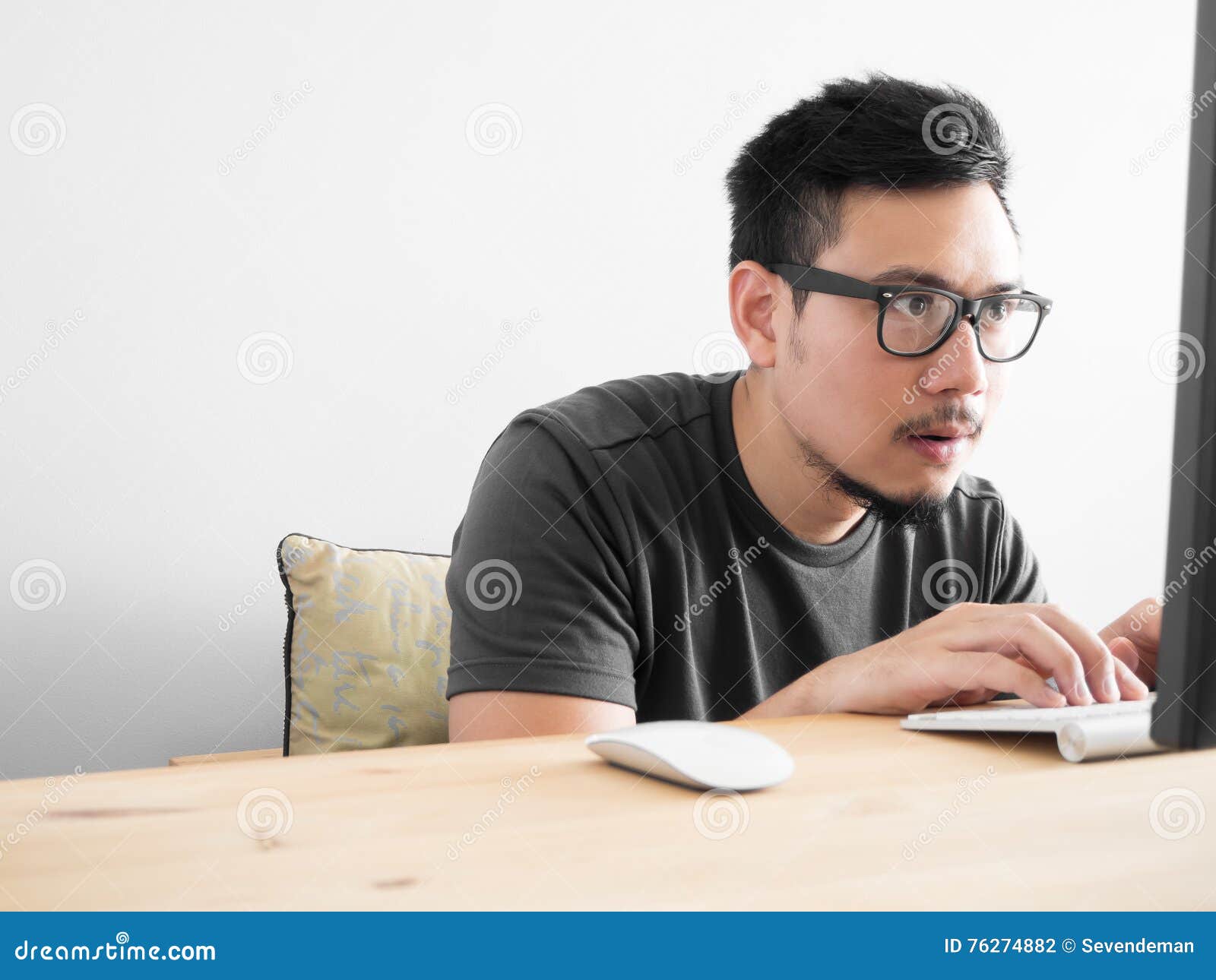 Asian Man Playing Mobile Game Seriously Stock Photo by ©sevendeman