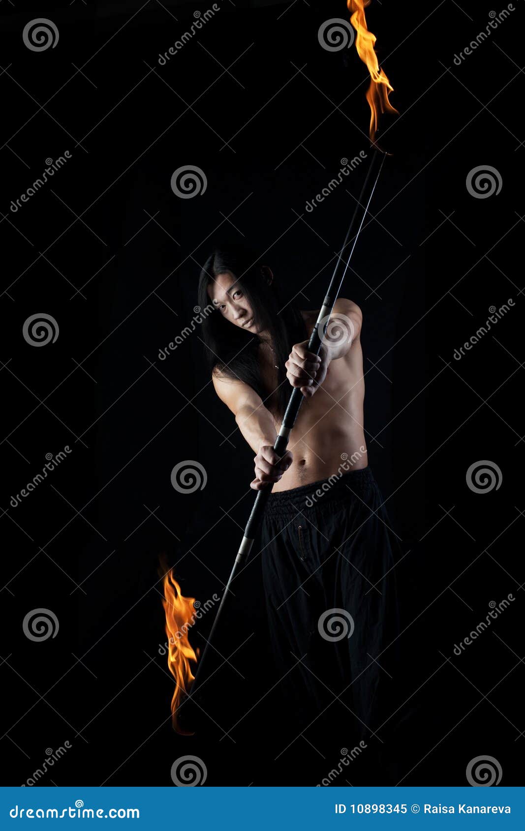 Young asian man with fire show