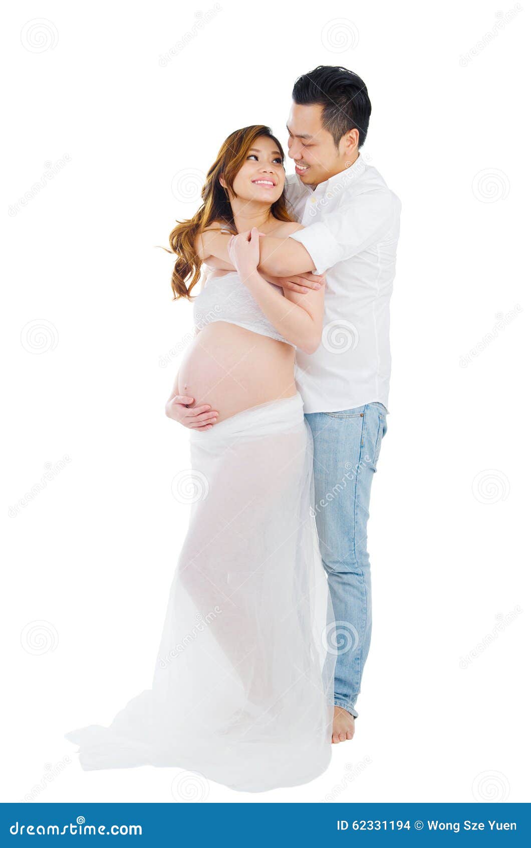Asian Man and His Pregnant Wife Stock Photo pic image