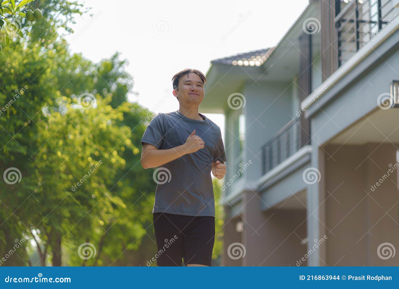 asian man are jogging in the neighborhood for daily health and well being, both physical and mental and simple antidote to daily