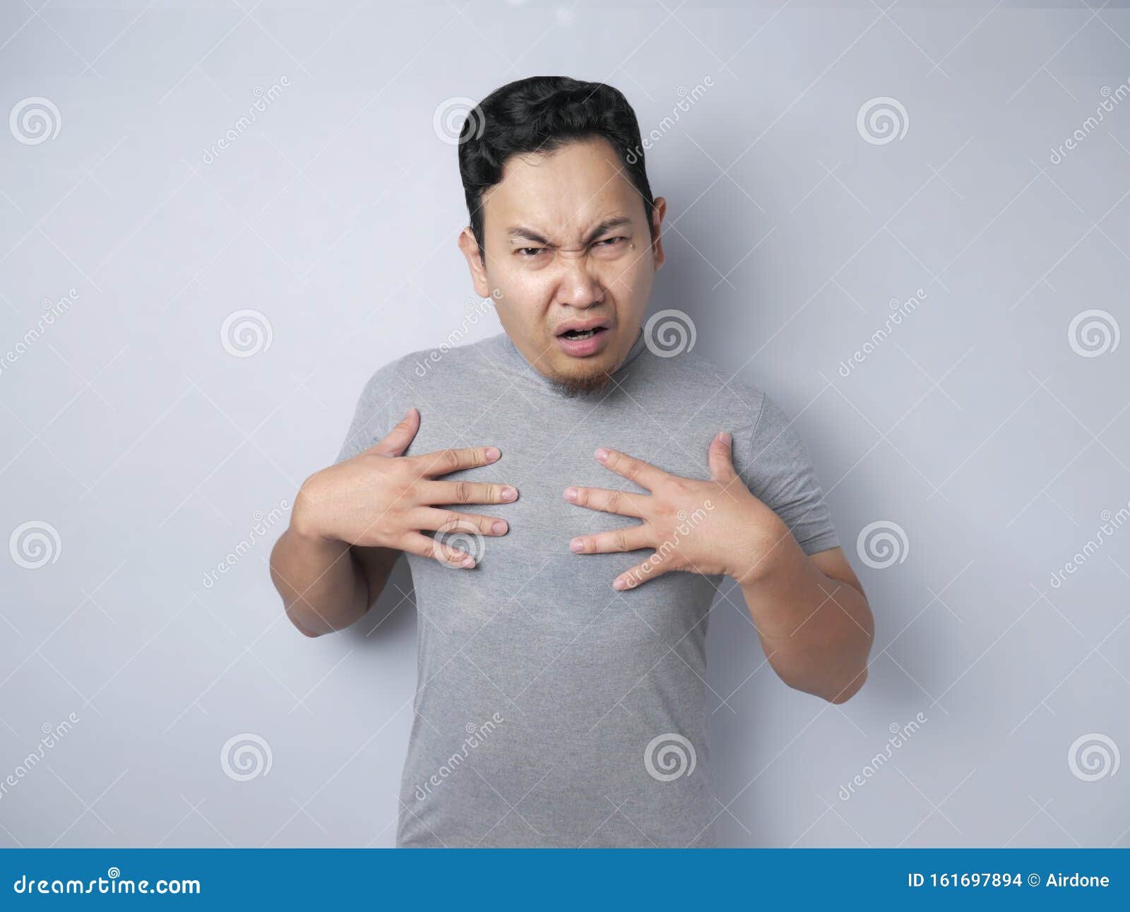 asian man pointing himself with unhappy expression as if he confused to be accused