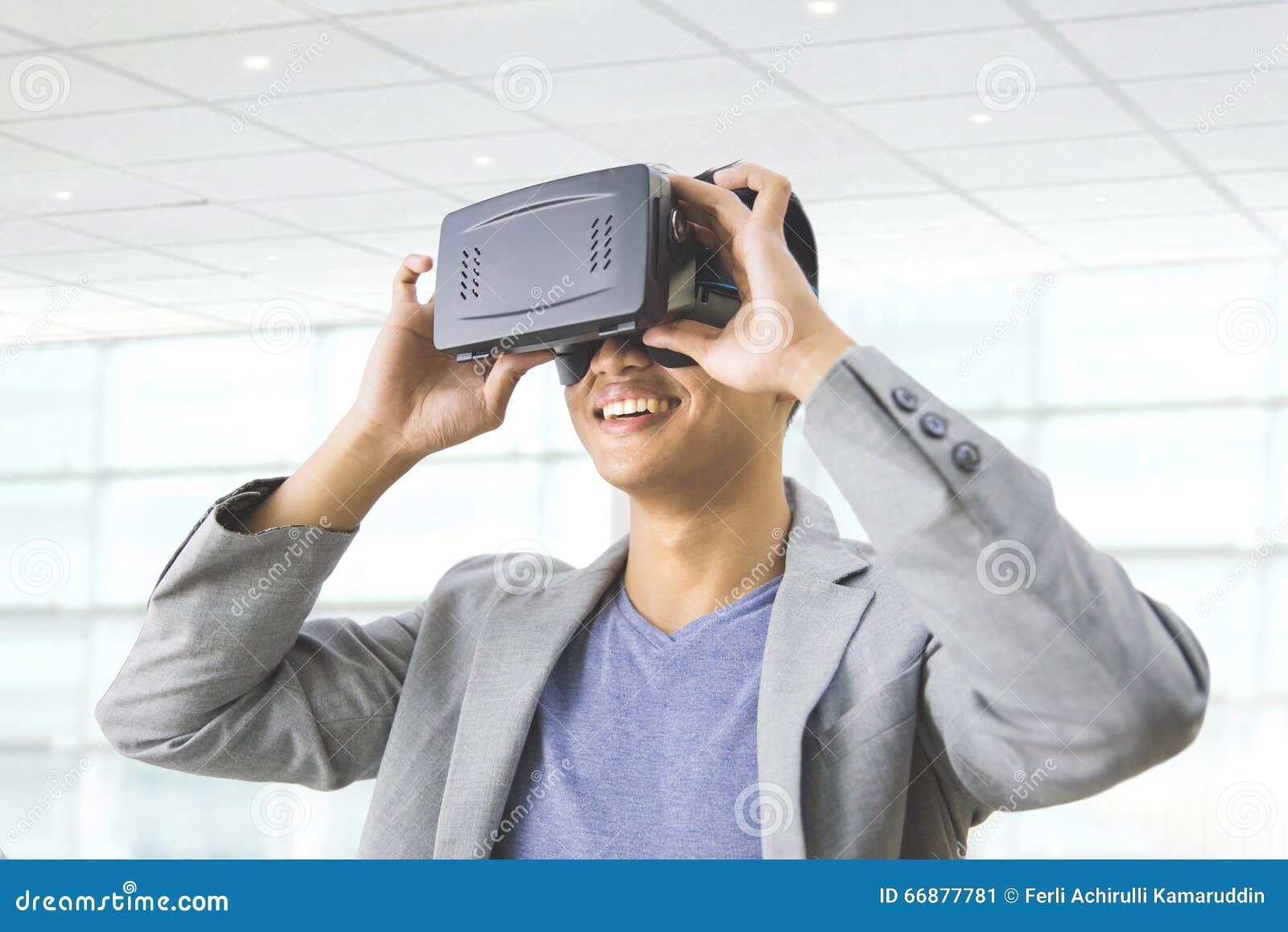 asian man wearing virtual reality goggle