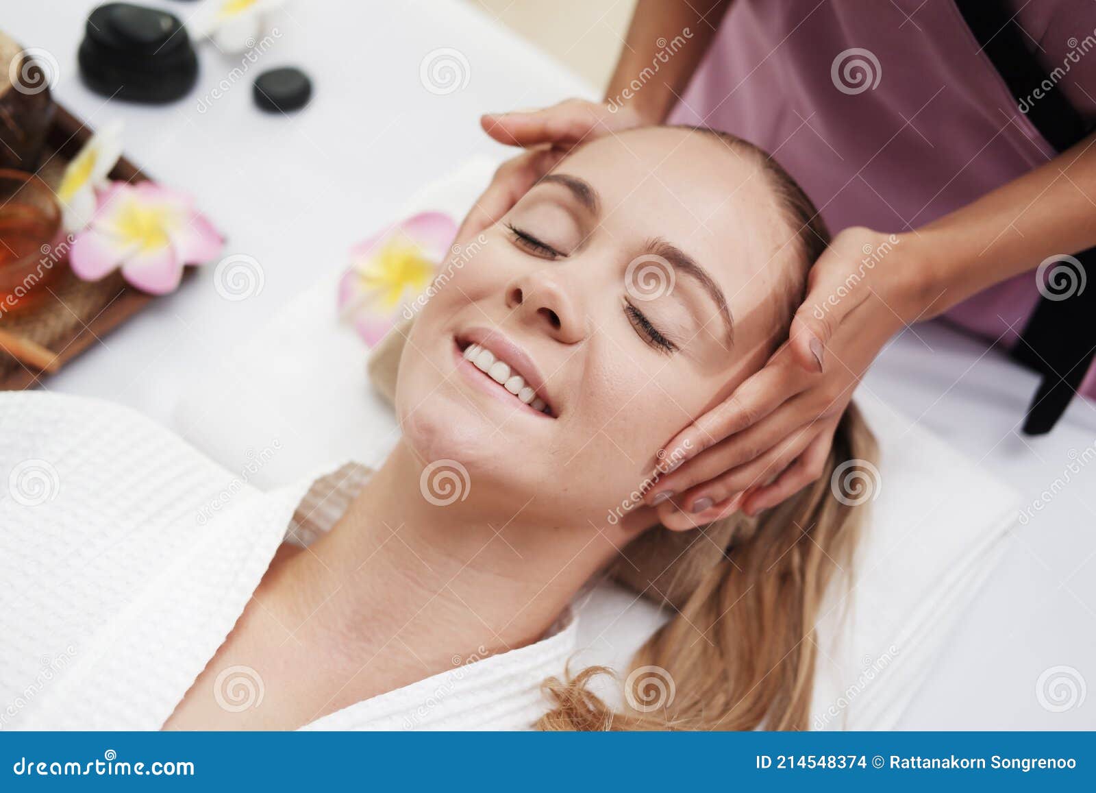 Asian Massage Therapist Woman Is Making Traditional Head And Facial Treatment Massage To