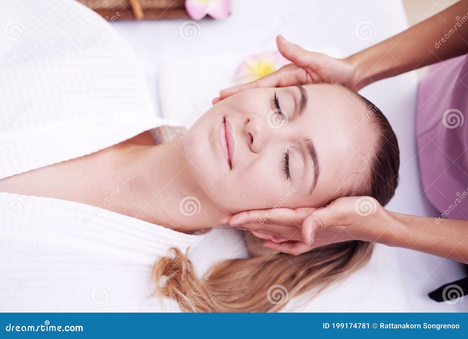 Asian Massage Therapist Woman Is Making Traditional Head And Facial Treatment Massage To