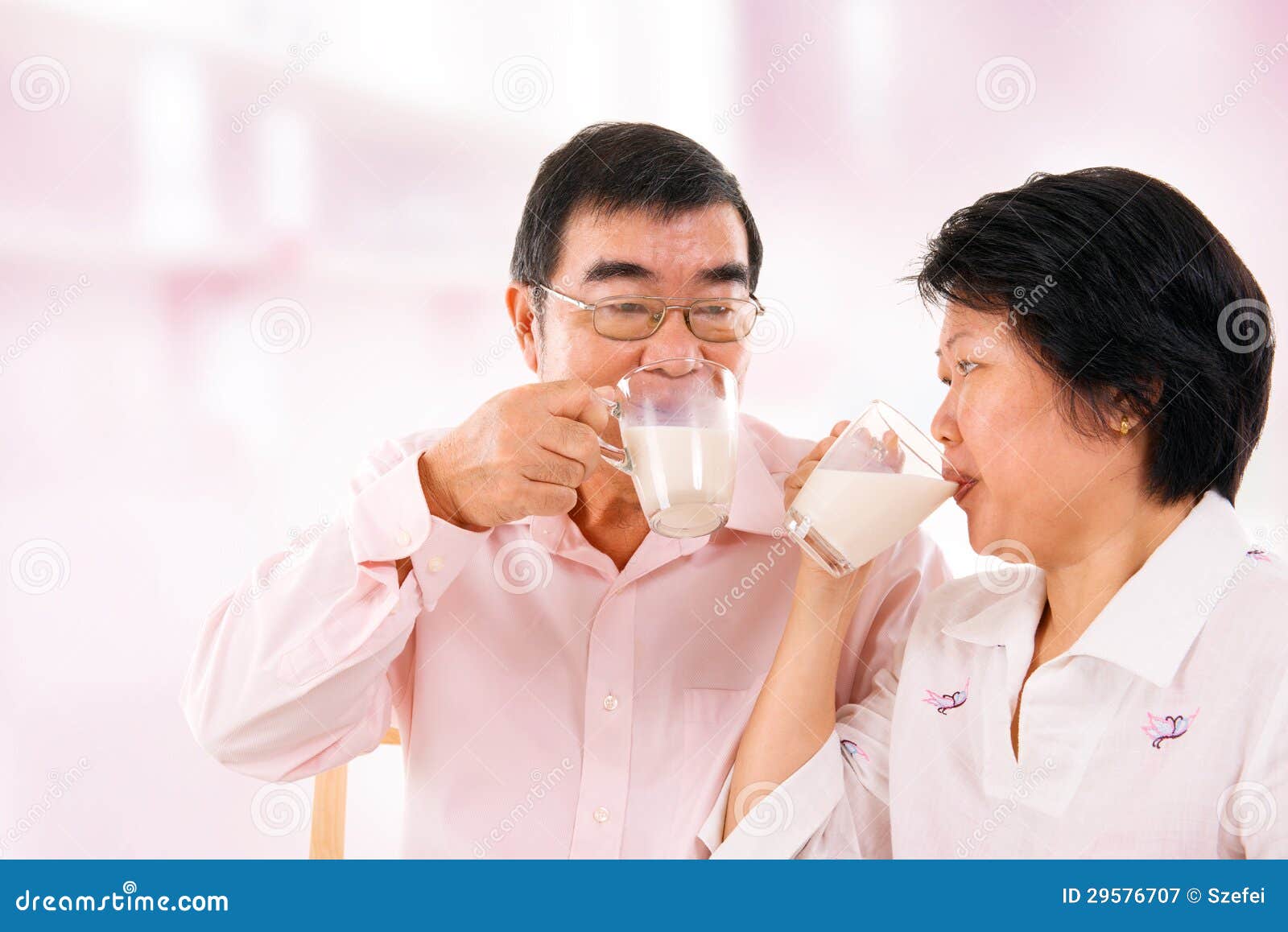 Asian Mature Couple Drinking Soy Milk Royalty Free Stock Photography