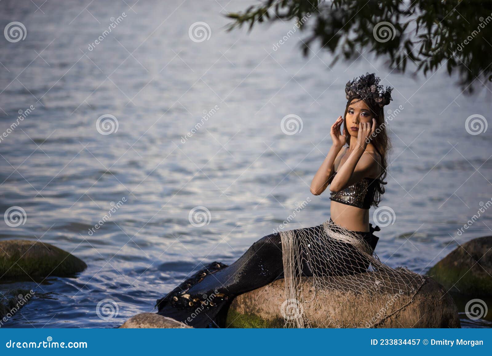 Asian Mermaid Caught in Net at Sea Coast on Rocks Wearing Seashell  Decorated Crown and Black Shiny Tail on Body Covered with Stock Image -  Image of female, costume: 233834457