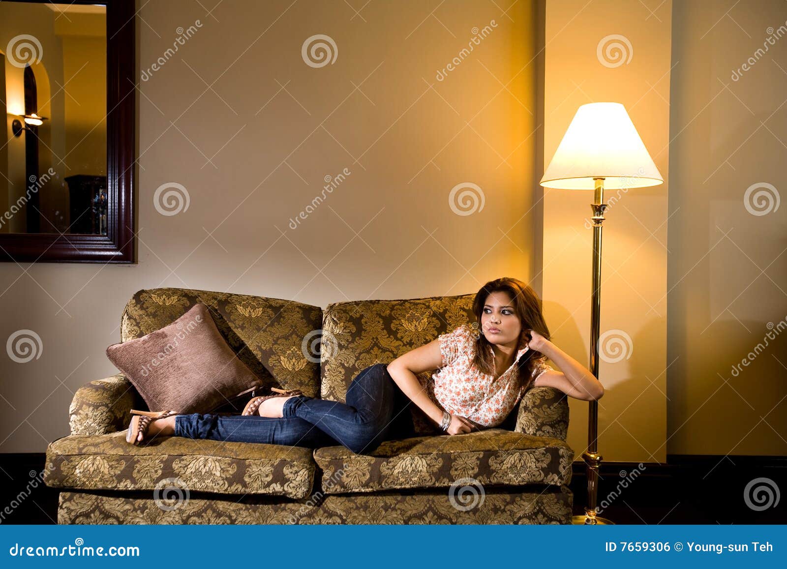 Stylish asian modern malay woman lean on sofa relaxing