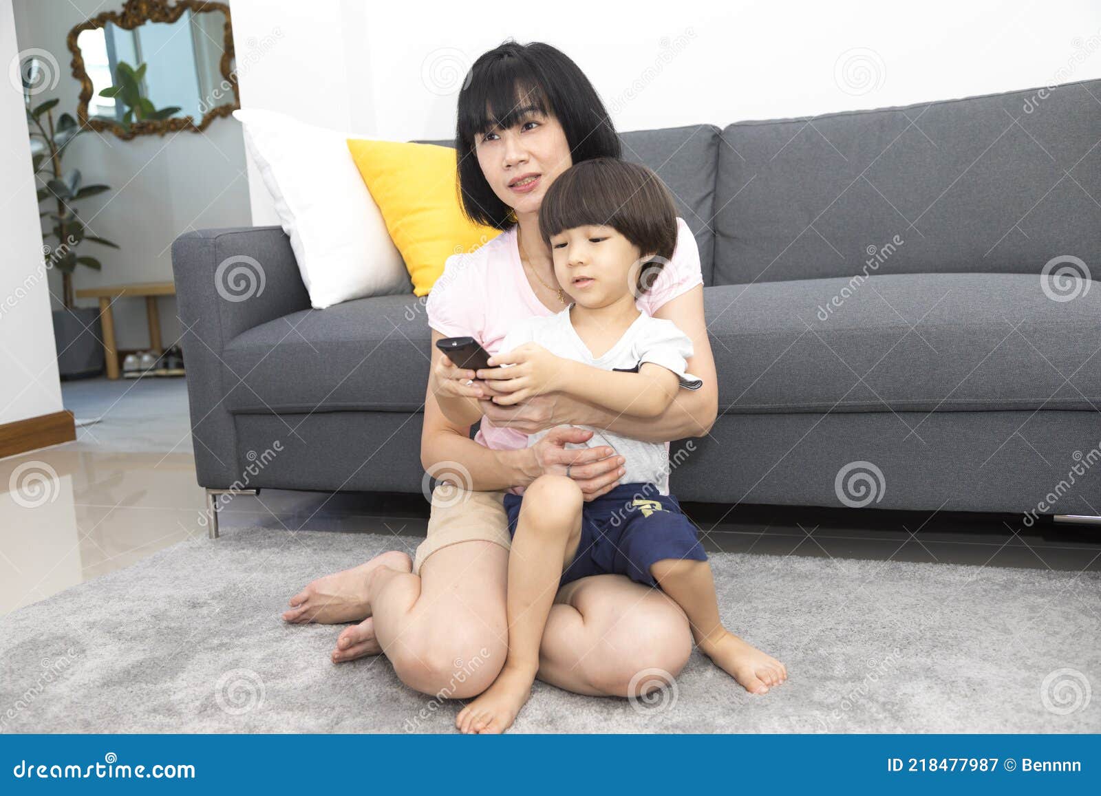Asian Mom And Son Couple Watching Tv On A Sofa At Home Stock Image Image Of Father Choice