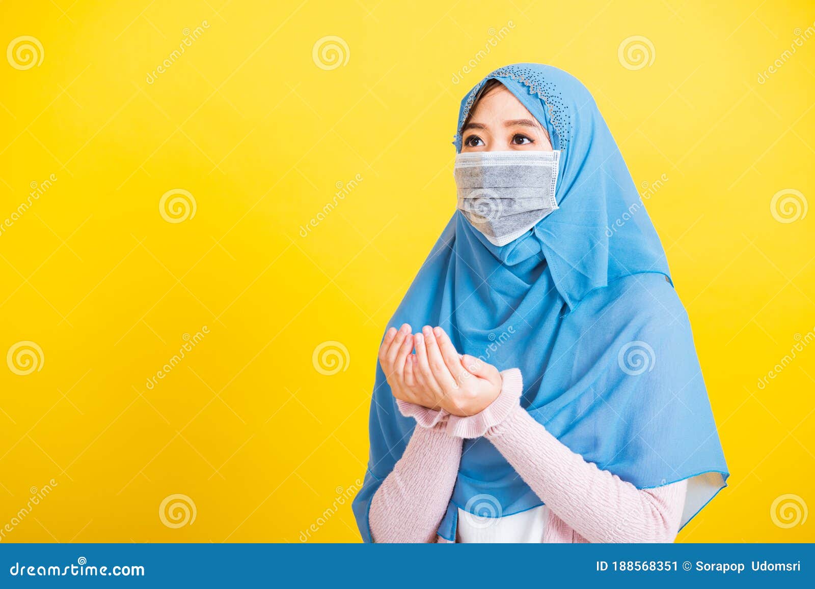 Woman Wear Hijab  And Face Mask  She Henna Decorated Hands 