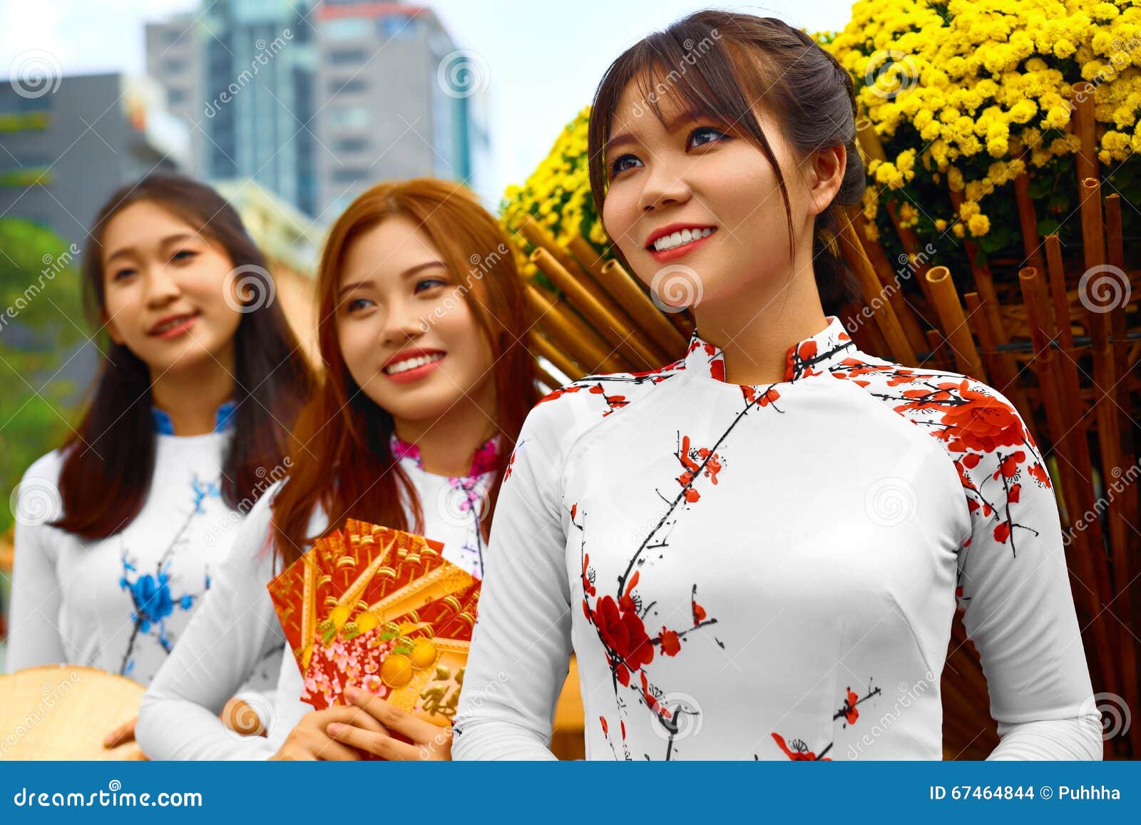 Asian People. Happy Women Wearing National Traditional Clothing. Stock