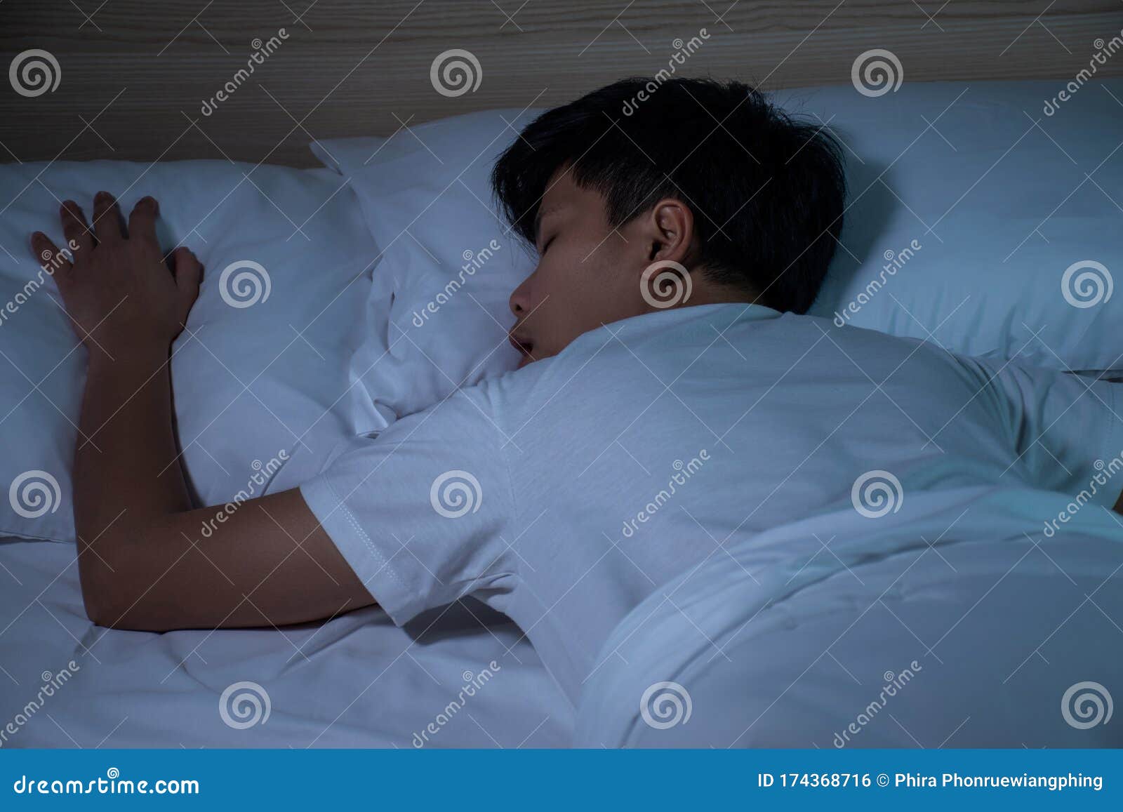 Asian People Sleep Face Down on a White Bed. Night Time Stock Photo ...