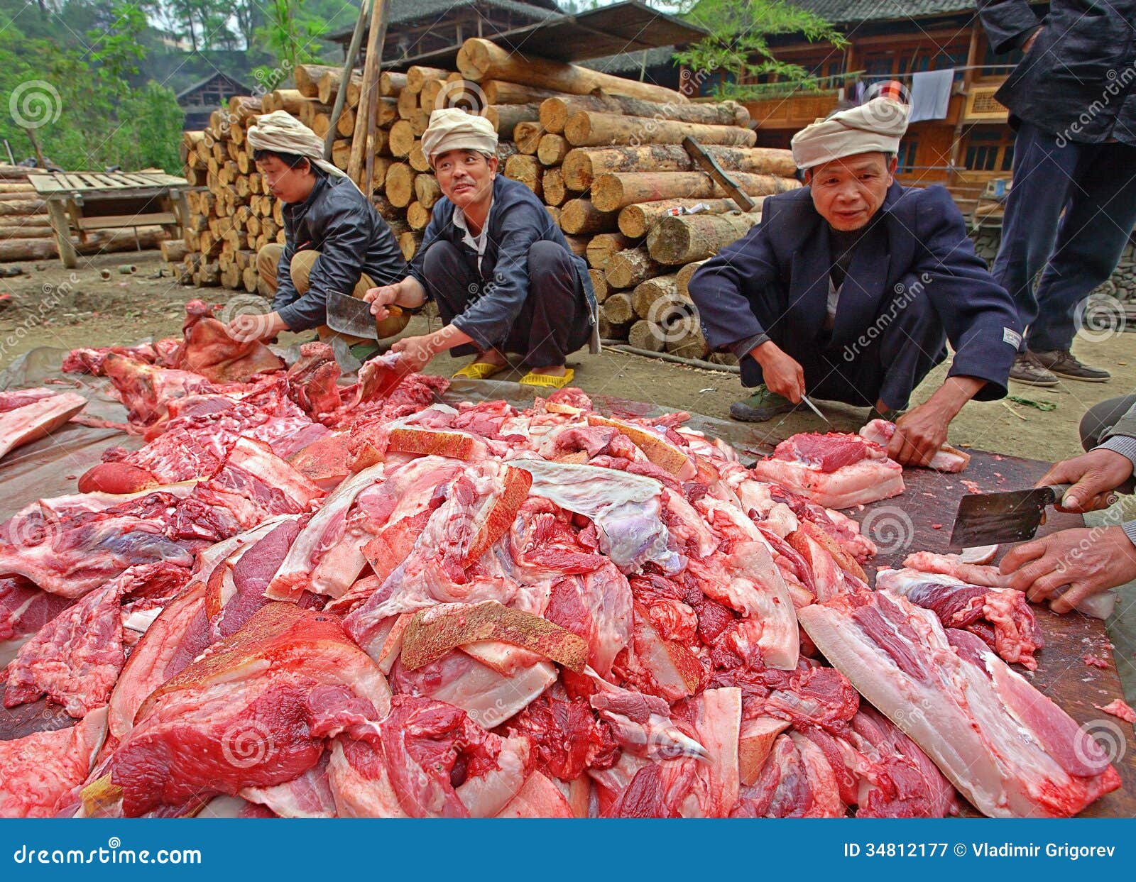 A Chinese butcher prepares meat in his shop in a village in China