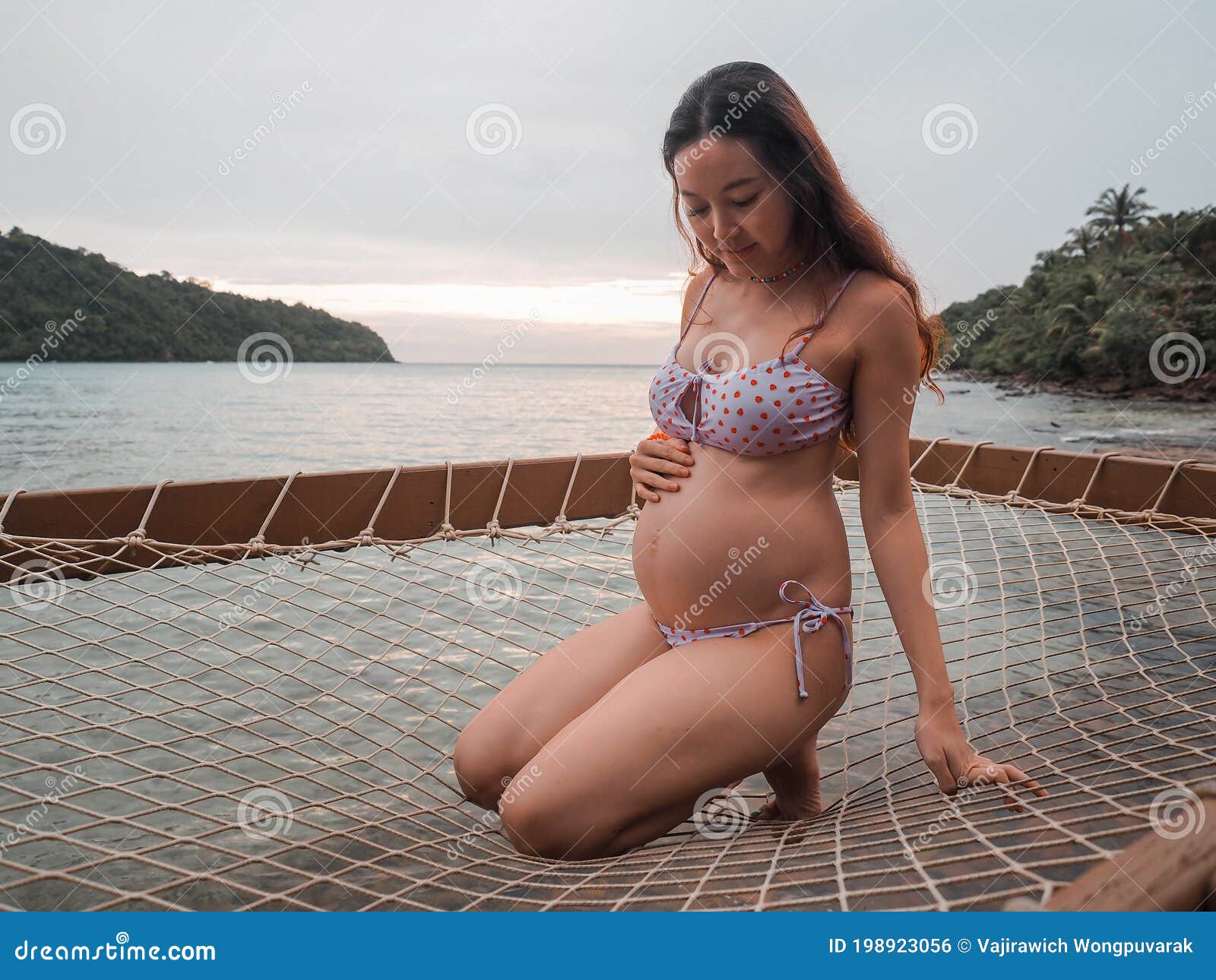 Asian Pregnant Woman in Bikini Sitting on in Turquoise Sea Water Near Beach. Tropical Beach in Koh Kut Island, Thailand Photo - Image of bikini, baby: 198923056