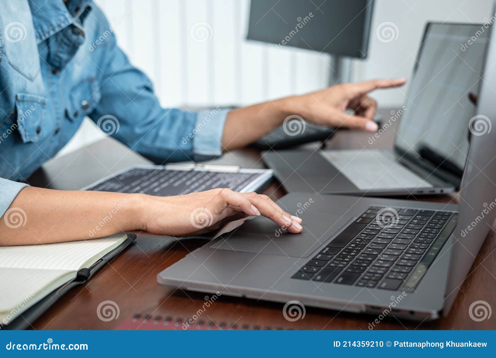 Asian Programmer Woman Pointing and Looking on Multiple Laptop Screen ...