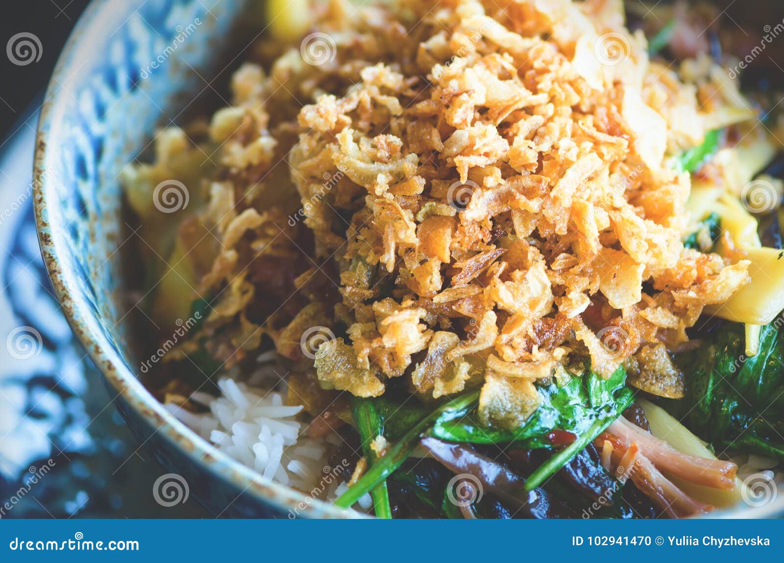 asian rice with pork, mu-err mushrooms, napa cabbage, pickled bamboo shoots, spinach, teriyaki, sweet chili sauce, onion