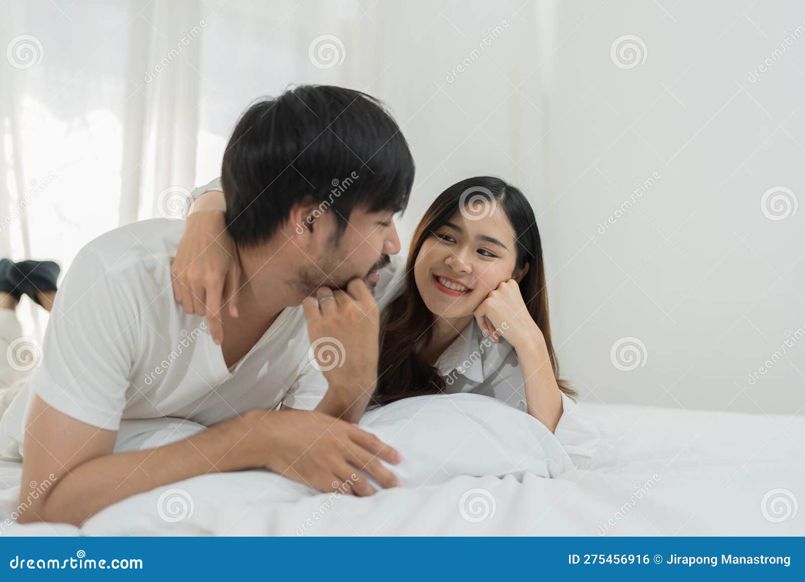 Asian Romantic Couple in Bed Enjoying Sensual Foreplay Happy Sensual Young  Couple Lying in Bed Together. Beautiful Stock Photo - Image of boyfriend,  hotel: 275456916