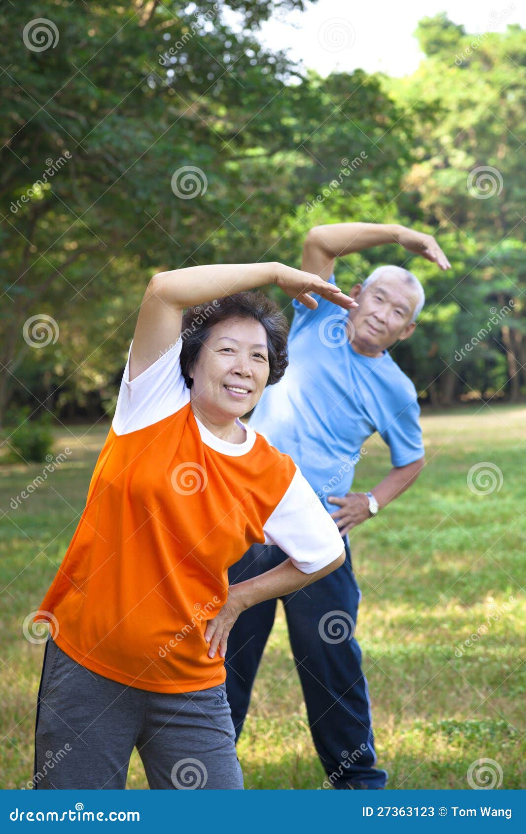 asian senior fitness couple in the park