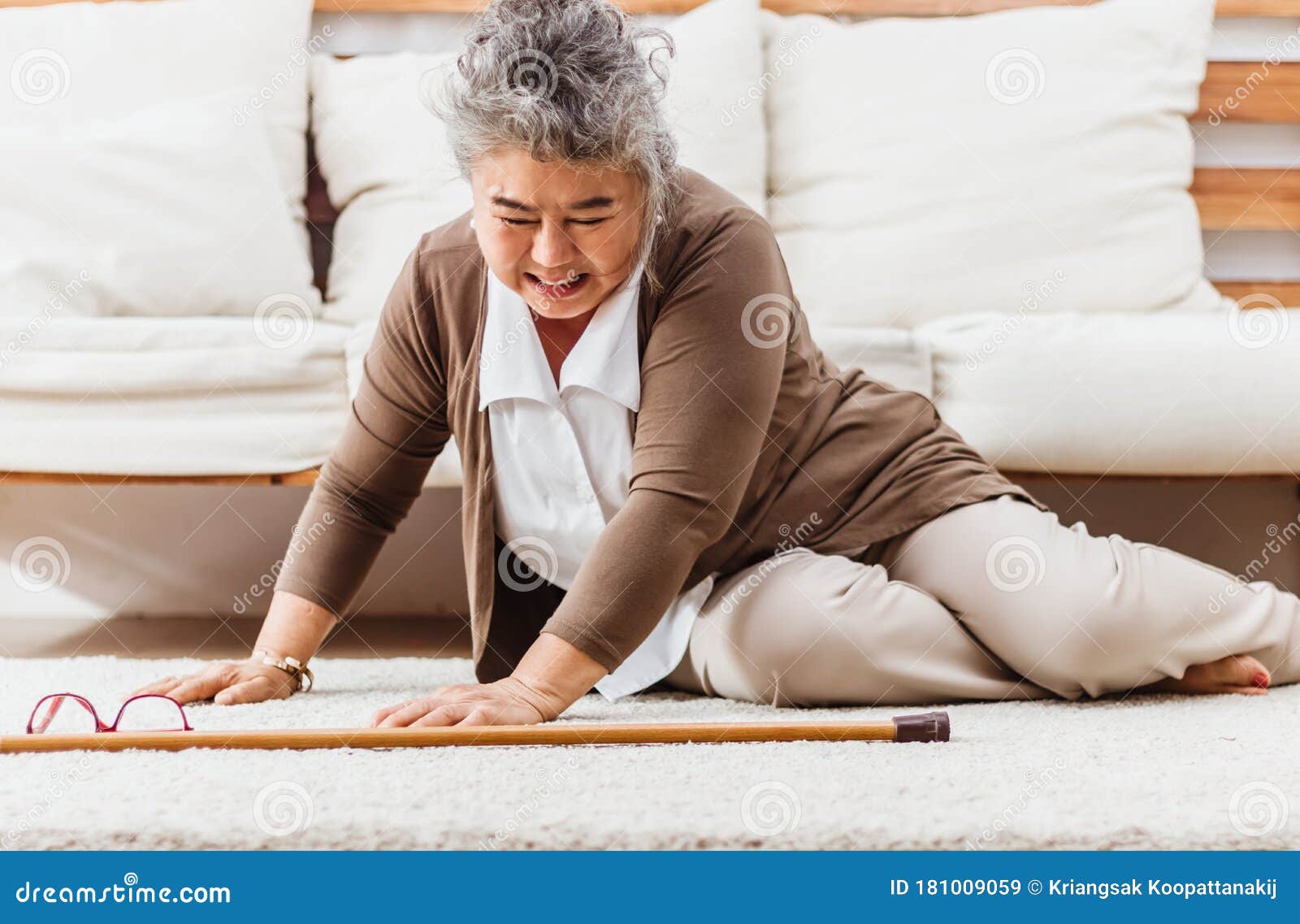 asian senior woman falling down lying on floor at home alone. elderly woman pain and hurt from osteoporosis sickness or heart
