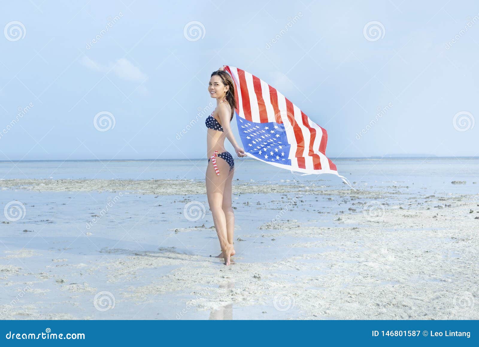 Asian Girl in Bikini of American Flag Holding a Waving American