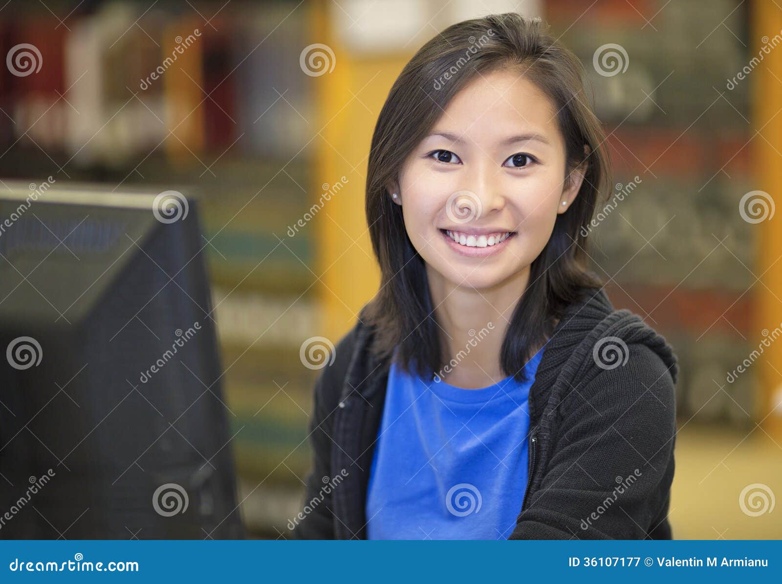 asian student working at computer
