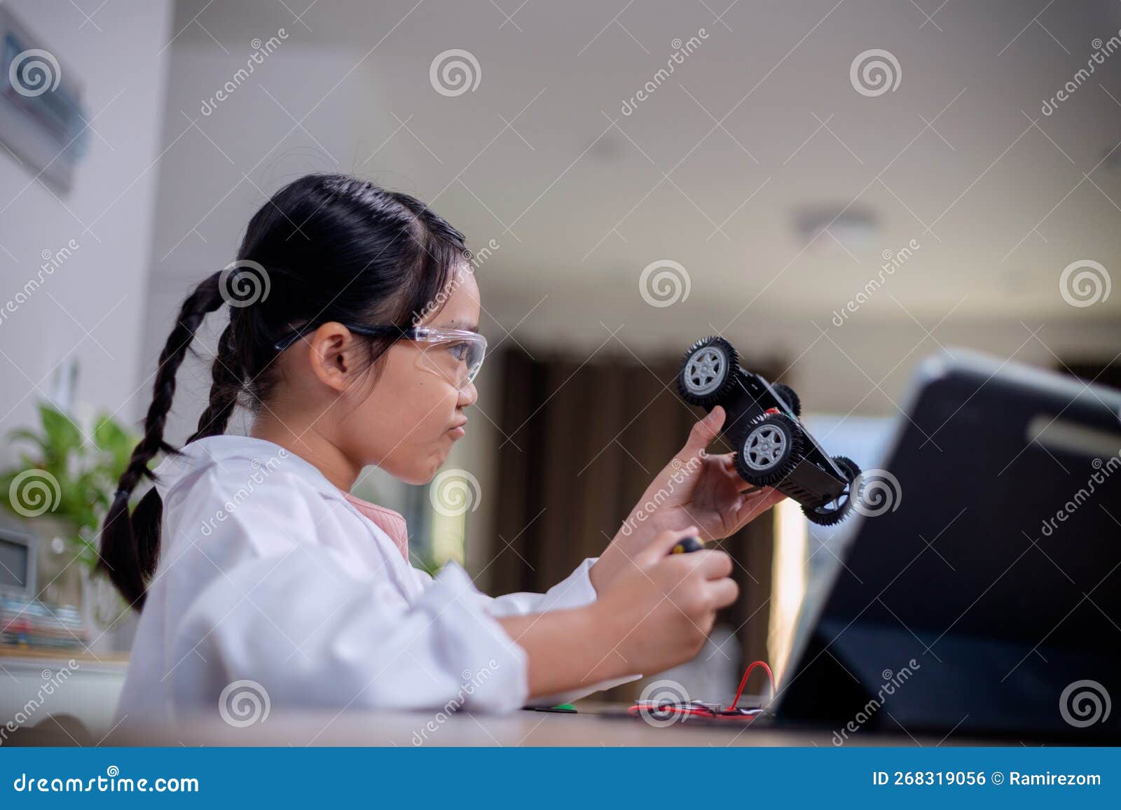 Asia students learn at home in coding robot cars and electronic